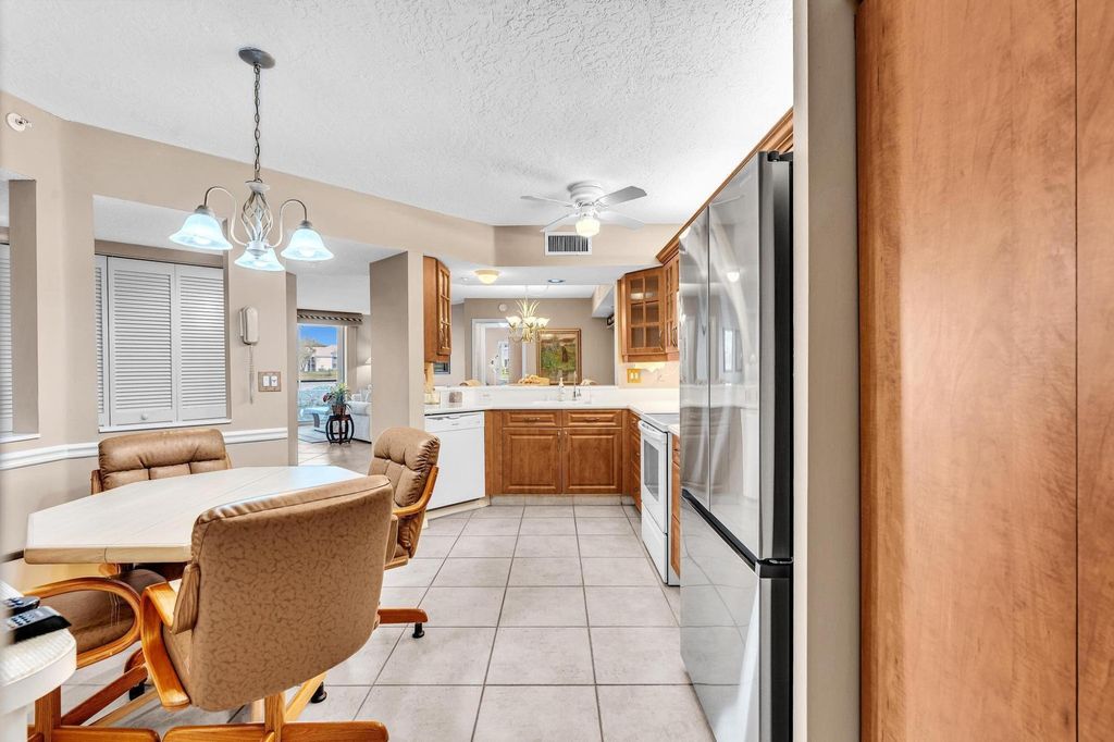 Photo of 9539 Weldon Circle #F107, Tamarac, FL 33321 (MLS # B26012969)