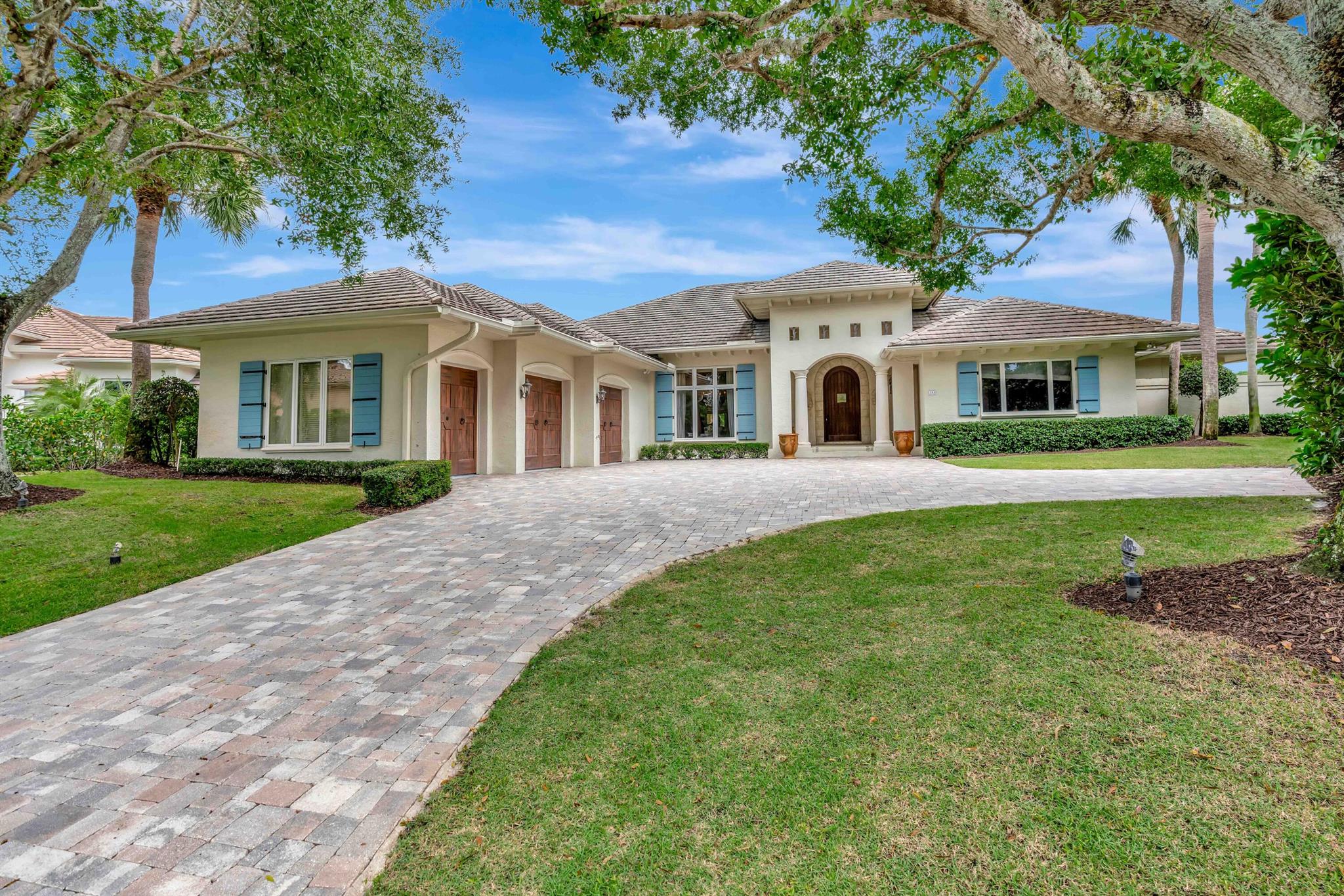 Welcome to one of the most coveted addresses in The Loxahatchee Club. Perfectly positioned at the end of a quiet cul-de-sac, this exceptional point lot offers some of the most spectacular golf and water views in the entire community. With sweeping vistas in every direction, this property represents a truly rare opportunity. The existing residence is move-in ready, offering comfortable living from day one -- yet it also serves as the perfect canvas for a major renovation or an extraordinary new build. Premier lots of this caliber are few and far between. Beyond the property, residents of The Loxahatchee Club enjoy world-class amenities including 18 holes of championship golf on a Jack Nicklaus Signature course with a renowned caddie program, a newly renovated clubhouse