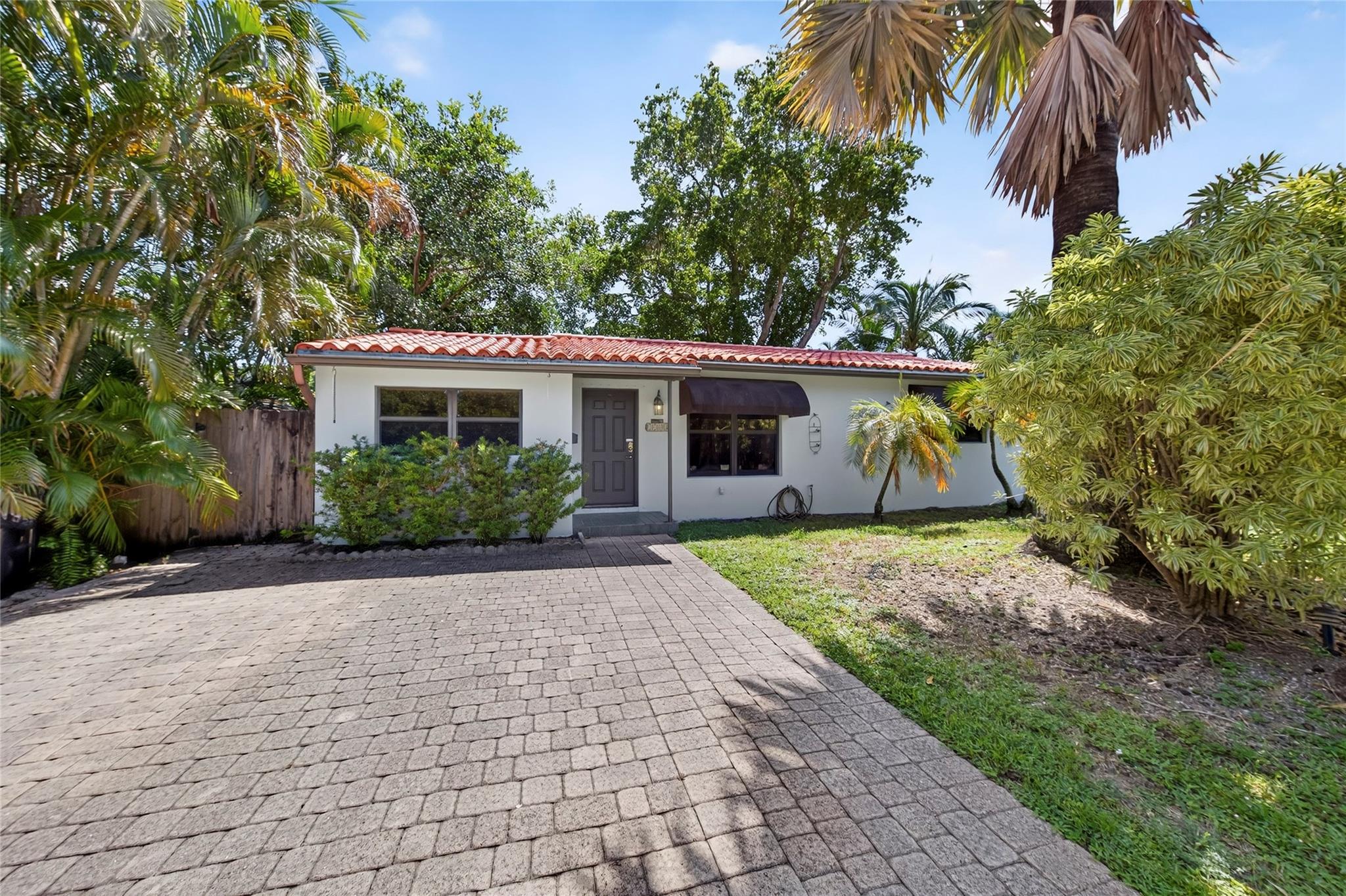 Welcome to this charming 3-Bedroom Home in Highly Sought-After Poinsettia Heights. This home offers spacious living areas ideal for both relaxing & entertaining and it's ready for you to make it your own. Inside and you’ll find a bright, open living room with large impact windows that fill the space with natural light. The kitchen and dining flow seamlessly into the main living areas, making daily living easy effortless. With two full bathrooms the home balances function and style. Outdoors, there's a full size shed that provides extra storage. You’ll enjoy lush tropical surroundings on the large lot. Located just minutes from Fort Lauderdale Beach, Wilton Manors, and downtown. This home is close to everything while nestled in a quiet, established neighborhood. Oversized Lot 60'X135'
