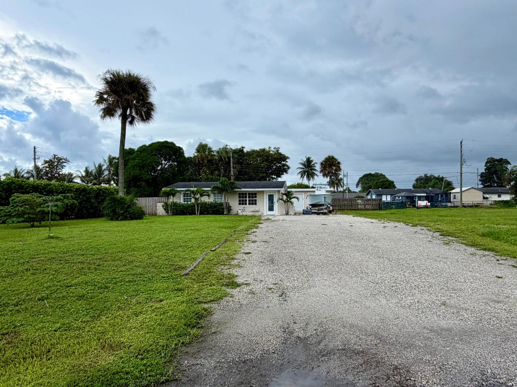Photo of 3540 Amy Avenue, West Palm Beach, FL 33403 (MLS # B26079379)