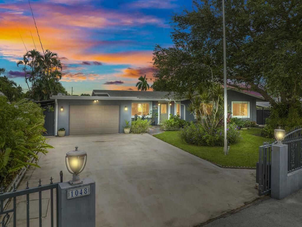 Photo of 1048 W Shore Drive, West Palm Beach, FL 33406 (MLS # R10921699)