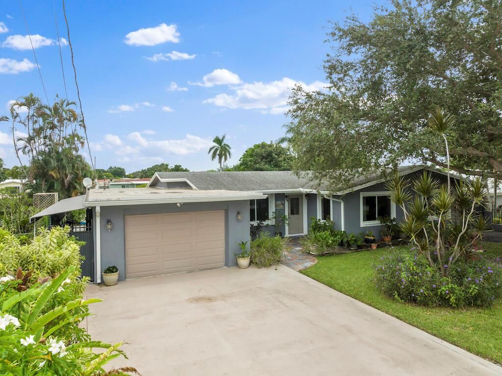 Photo of 1048 W Shore Drive, West Palm Beach, FL 33406 (MLS # R10921699)