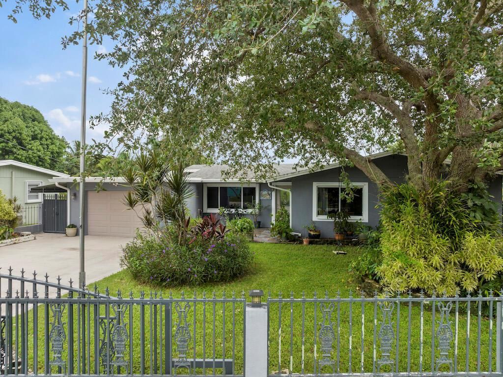 Photo of 1048 W Shore Drive, West Palm Beach, FL 33406 (MLS # R10921699)