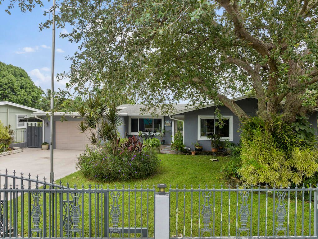 Photo of 1048 W Shore Drive, West Palm Beach, FL 33406 (MLS # R10921699)
