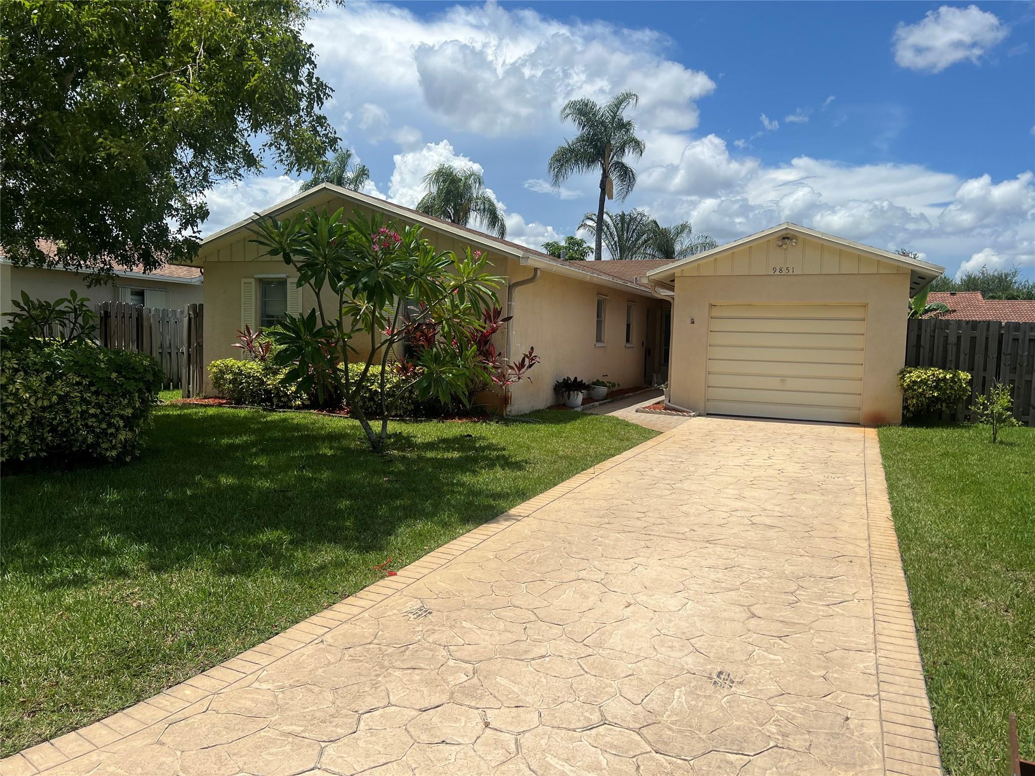 Amazing opportunity to add your own finishing touches to single family home near Downtown Coral Springs. Walking distance to shopping, restaurants and more! This freshly painted home features a inviting living area, functional kitchen and generously sized bedrooms with plenty of natural light. New luxury vinyl flooring in bedrooms. Situated on a good-sized lot with a backyard ideal for entertaining or gardening. Lovely garden with Fruit trees. Newer a/c, Exterior painting and a new roof coming soon, within next 30 days. Don’t miss out on this hidden gem!