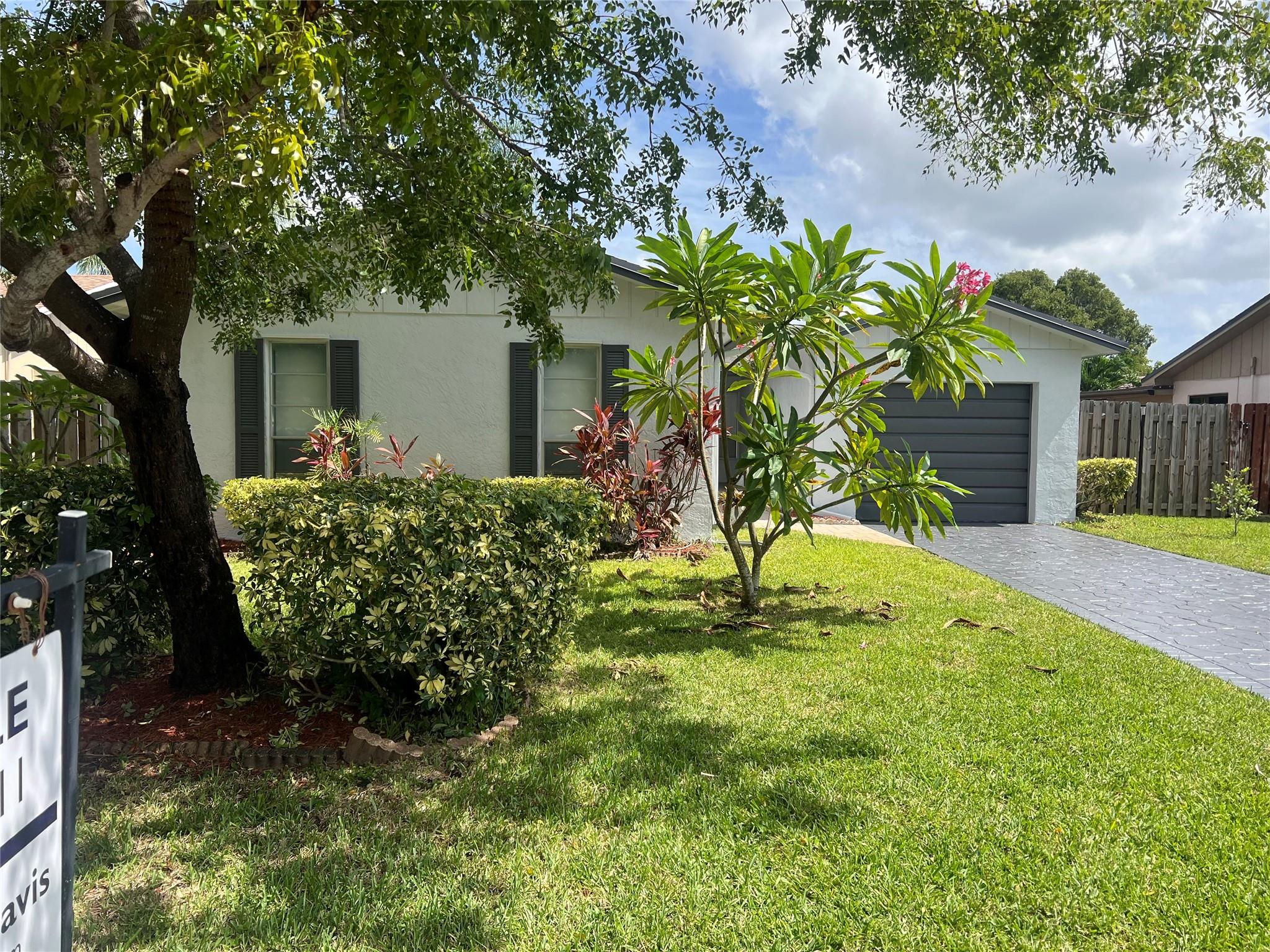 Amazing opportunity to add your own finishing touches to single family home near Downtown Coral Springs. Walking distance to shopping, restaurants and more! This freshly painted home features a inviting living area, functional kitchen and generously sized bedrooms with plenty of natural light. New luxury vinyl flooring in bedrooms. Situated on a good-sized lot with a backyard ideal for entertaining or gardening. Lovely garden with Fruit trees. Newer a/c, Exterior painting and a new roof coming soon, within next 30 days. Don’t miss out on this hidden gem!