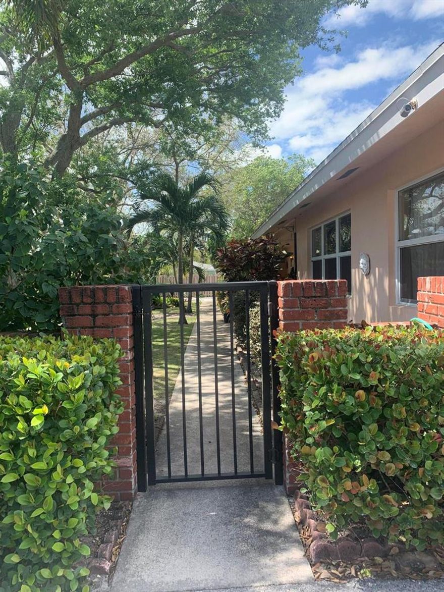 Ideal location in the heart of downtown Delray within walking distance to shops/dining and a few blocks from the beach! Located in well maintained 4-plex bldg. offers 2 parking spaces right out front, front covered patio areas and a charming large & shaded courtyard with mature trees, golf-course grass and chairs/tables for lounging. Notable features: freshly painted; tile floors throughout; newer kitchen cabinets; newer glass-top stove & fridge; newer AC under a service contract; full-size washer/dryer in the unit in it's own laundry room.  No dogs allowed at all.  1-2 Cats permitted with $150 non-refundable pet fee.