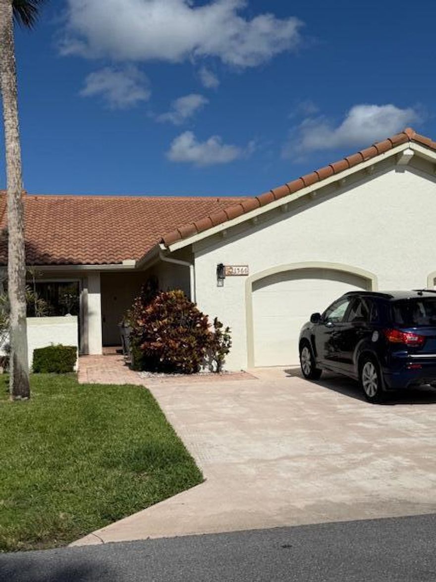 Come home to your pretty, tranquil villa community. This home has attached garage and private front porch.  Screened back porch with ceiling fan looks into your private fenced yard.  Eat-in kitchen. Living room with vaulted ceilings.  Split bedrooms gives you privacy.  Primary bedroom has a walk in closet plus another double wide closet, and sliders onto an separate porch. Wall to wall and floor to ceiling sliding doors in living room lead to the screened lanai with ceiling fan for extra comfort on summer days. Eat in kitchen also has a full wall of sliding doors for amazing sunlight. Accordian storm shutters on windows. This community has a community pool and other amenities to round out your lifestyle.