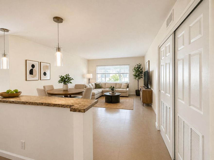 MUST SEE! Completely remodeled spacious condo in great location. Just minutes from the beach. Impact windows. Contemporary kitchen with granite counter tops and SS appliances. New refrigerator. Tile throughout. Smooth white ceilings. Newer A/C. Unit is on first floor. Lots of closet space incl. walk in closet. Best building in the community adjacent to the pool and canal. 2 assigned parking spaces. All ages welcome. Investor friendly. Rent right away. Just off Atlantic, close to I-95 & US-1. Close to shopping, restaurants and entertainment. Enjoy the beautiful pool area right on the canal with views of the Intracoastal Waterway. New roof. Low fees.