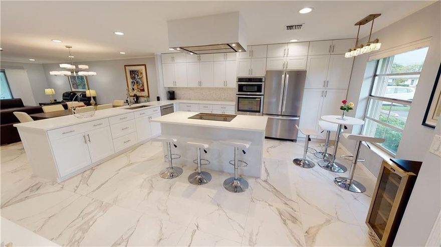 55+ COMPLETELY UPDATED just bring your toothbrush! Come see this beautiful contemporary FURNISHED corner villa located in BridgeView. Gorgeous kitchen with custom wood cabinetry, oversized island, quartz counters & stainless steel appliances. Porcelain tiled flooring throughout including screened patio. Bathrooms completely updated & both bedrooms with walk-in closets. FULL SIZE WASHER/DRYER & NEW AC. No properties behind with an open back view. Feels like a single family home. Parking is right outside your door. Accordion shutters all windows & new plantation shutters inside. Close to shopping, downtown & beaches. Condo fee includes cable, internet, water, trash & AMENITIES. Community offers pool, tennis, clubhouse, billiards, library & more.