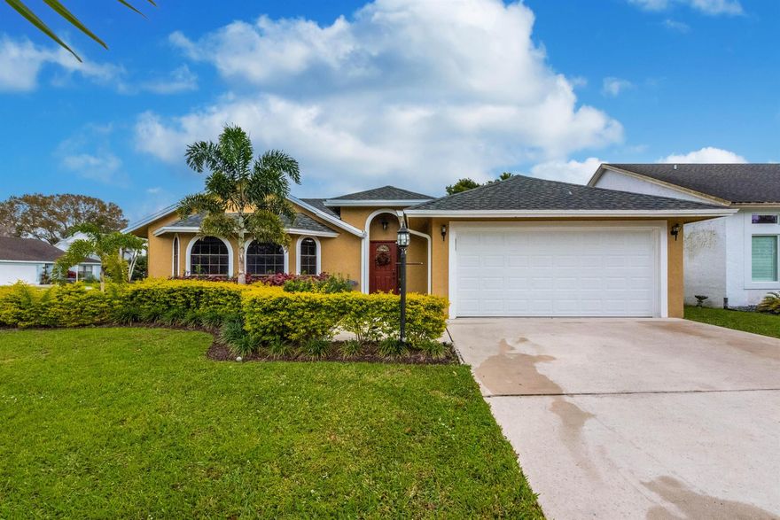 Beautiful corner home in desirable Meadowland Cove.  This is the only gated community in Big Blue Trace located in the heart of Wellington.  The fabulous kitchen was recently remodeled with an open concept, gorgeous quartz island and new stainless steel appliances.  Enjoy the many upgrades in this home which were done with great taste and quality finishes, flooring, interior paint, functional primary bath and more.  Large lanai which opens the possibilities for nice gatherings.  The lanai can easily flow with the living area of the home allowing even larger parties with friends and family.  Very low HOA and a great clubhouse, pool and boat ramp just steps away. Call today before its gone!!!