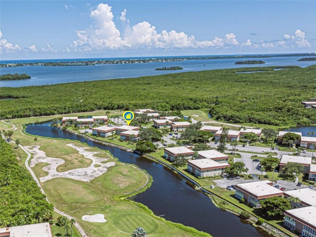 If you love the 1/1.5 model, this unit is standout! Featuring top-tier upgrades, including an enclosed lanai, impact windows throughout, '21 A/C, '21 water heater, '20 roof & fresh exterior paint. Inside enjoy stylish upgrades & an abundance of natural light. Located in a desired building, this home offers serene water views & overlooks the lush golf course fairway. The property boasts low taxes & a maintenance package that covers practically everything. Enjoy the incredible amenities, including 4 clubhouses, heated pools, tennis courts, & golf, furnishings negotiable.