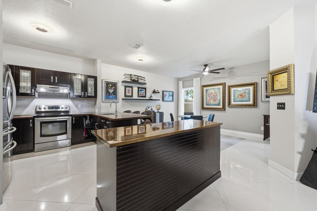 Photo of 5673 NW 117th Avenue, Coral Springs, FL 33076 (MLS # B26041981)