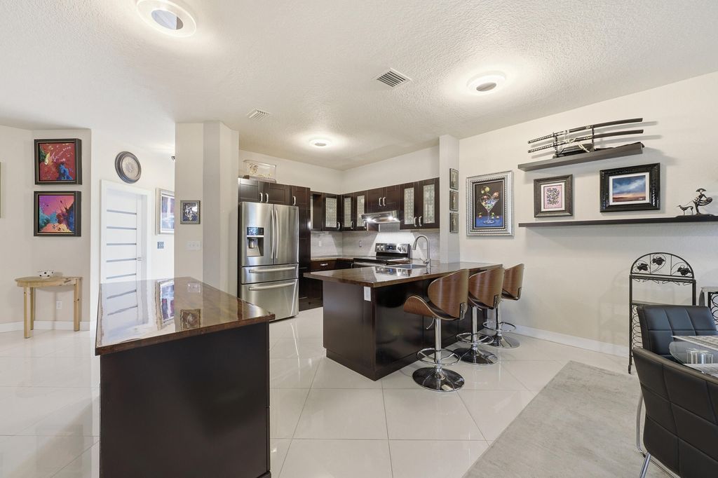 Photo of 5673 NW 117th Avenue, Coral Springs, FL 33076 (MLS # B26041981)