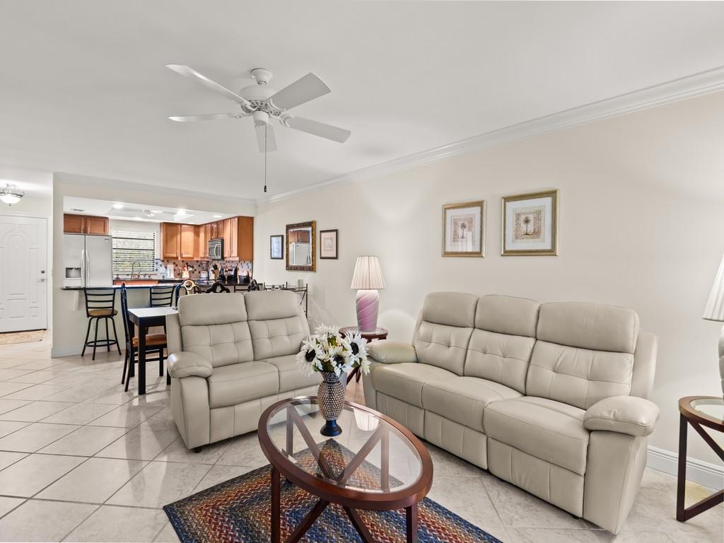 Welcome to your turn key and move-in ready retreat in the heart of Vero Beach! This spacious 2-bedroom, 2-bath condo offers comfort and convenience with tile flooring throughout, a bright kitchen, and a private screened balcony perfect for relaxing. The primary suite features ample closet space and an en-suite bath, while the split floor plan provides privacy for guests. Located just minutes from beaches, shopping, and dining, this community offers a pool and clubhouse for easy Florida living. Perfect for year-round or seasonal enjoyment!