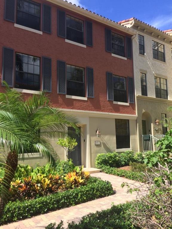 3-story townhome in the heart of Rosemary Square (formerly known as CityPlace). Located on lushly landscaped courtyard that is peaceful, private, and secure. First floor is tiled throughout, has a large den (property appraiser records show the den as the third bedroom), powder room, two-car garage. Second floor has wood flooring in the living and dining areas, upgraded kitchen has tile floors, granite counters, stainless steel appliances, full-size side-by-side W/D. Third floor has a large suite with two walk-in closets, wood flooring, and double sinks in the bath. The guest suite is also on the third floor and has wood floors, a wall of closets, and an en-suite bath. Walk to Publix, shopping, dining, and entertainment! Annual lease only. One small pet ok.