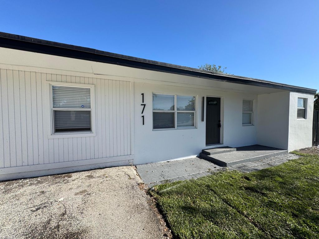 Photo of 171 Loquat Tree Drive, Lantana, FL 33462 (MLS # R11066033)