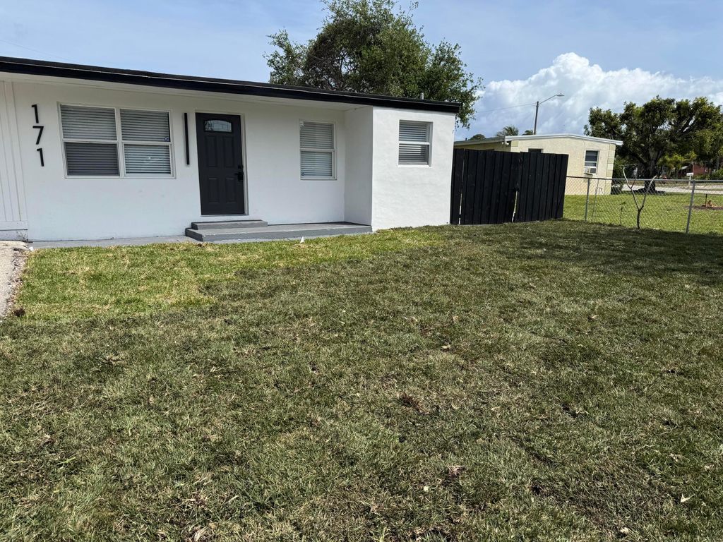 Photo of 171 Loquat Tree Drive, Lantana, FL 33462 (MLS # R11066033)
