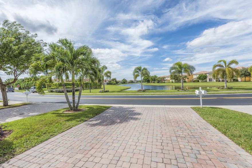 Beautiful Home with lake views in front and back. 2 car garage. Brick patio wraps around to back yard. 24 manned gated security. 3/2/1 with large open loft area. No carpet. Tile and laminate. Fenced backyard.  Huge mango tree in backyard.  Resort style clubhouse- gym, tennis and pickleball courts, splash park, playground, large pool and hot tub. close to TP and 95. Downtown West Palm Beach and Beaches less than 20 min away.