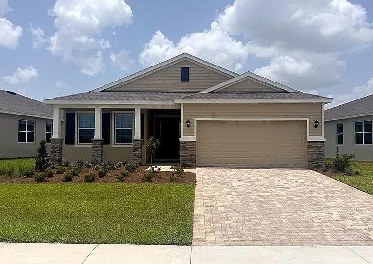This New Construction, 3 bedroom, 2 Bath with 2 car garage home in the gated community of Ocala Preserve, less than 10 minutes from the World Equestrian Center is available for long term rental. This home offers high ceilings and big windows that invites natural lighting. The open concept living space has a modern kitchen that is complete with granite countertops with ample space to entertain. The master ensuite bathroom has dual sinks with a huge walk-in closet. This split bedroom plan offers two additional bedrooms for family or guest. Enjoy your private back yard which has a huge covered patio where you can relax. Amenities include access to a resort-style clubhouse and pools, tennis and pickleball courts, fitness center, miles of walking trails with a generous amount of green space.