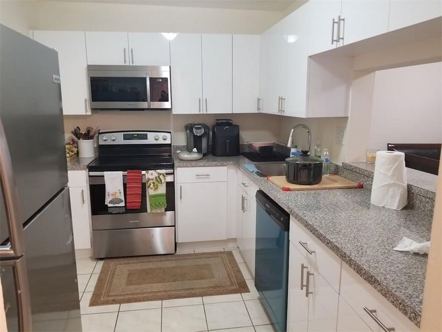 INVESTORS DREAM! 2ND FLOOR UNIT, ELEVATOR, 2/2, GARDEN VIEW, REMODELED KITCHEN WITH ALL NEW APPLIANCES, TILE FLOOR THROUGHOUT, NEWER A/C. NO LEASE RESTRICTIONS.