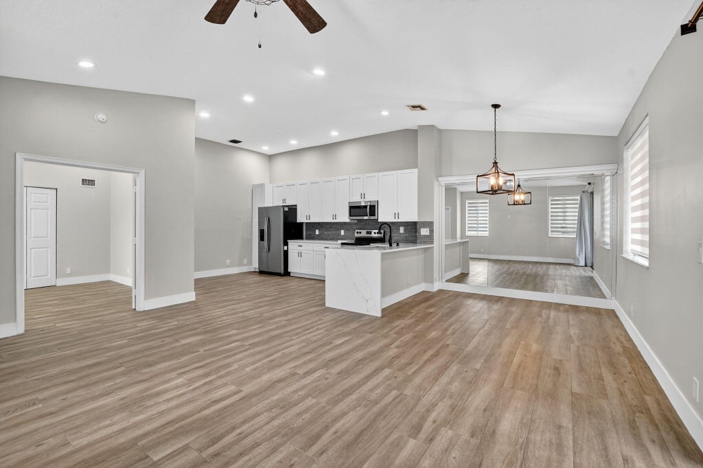 Photo of 851 NW 42nd Place, Deerfield Beach, FL 33064 (MLS # B26086934)