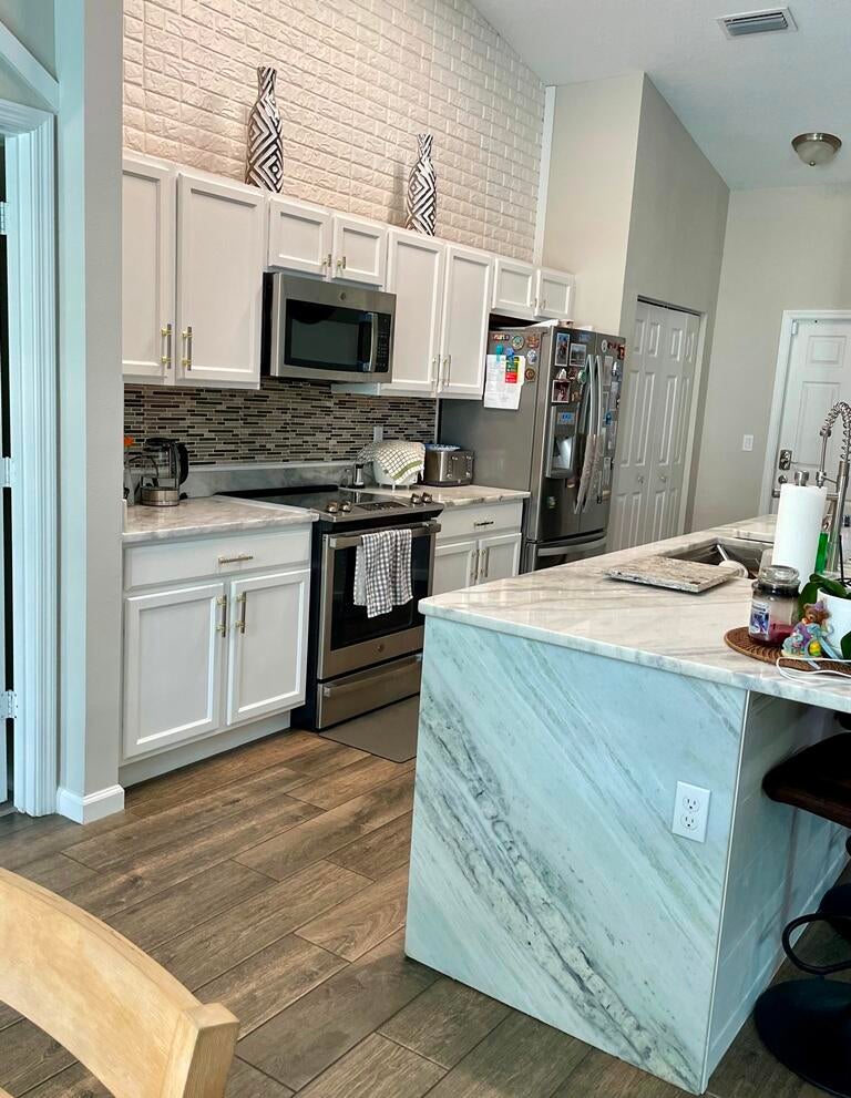 Photo of 1097 SW DARTMOUTH Avenue, Port Saint Lucie, FL 34953 (MLS # B26069024)