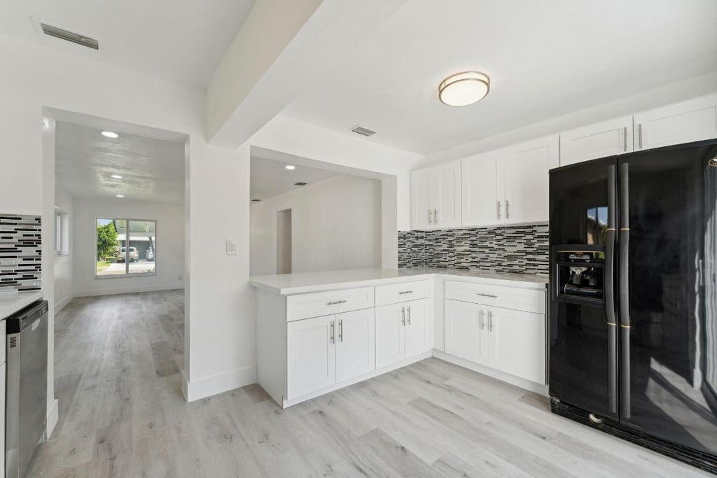 Photo of 661 NW 2nd Way, Deerfield Beach, FL 33441 (MLS # R11060939)