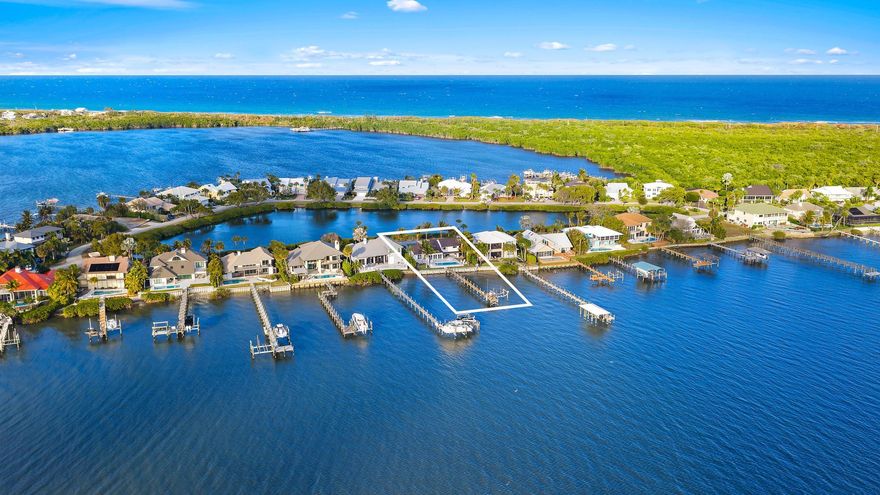 Completely reimagined and rebuilt to the studs in 2021, this exceptional Intracoastal residence in Joe's Point offers panoramic water views and private deeded beach access just steps away. Nearly every room captures sweeping vistas of the water, creating a seamless connection between indoor living and the coastal landscape.

Thoughtfully designed with refined coastal finishes, the home showcases reclaimed wide-plank hardwood flooring, shiplap detailing, and a statement fireplace anchoring the great room. The open-concept floor plan flows effortlessly from the living and dining areas--featuring a pecky cypress ceiling--into a chef's kitchen equipped with premium Thermador appliances, custom cabinetry, expansive island seating, dual-fuel double ovens, and a wine cooler, ideal for both dail living and entertaining.

Two guest bedrooms are located on the first floor, while the private upper-level primary suite offers commanding water views, a spa-inspired bath with soaking tub and walk-in shower, dual vanities, and a generous custom closet.

Outdoor living is equally impressive, highlighted by a covered lanai with remote-controlled screens, pecky cypress ceiling, summer kitchen with grill and refrigeration, and generous entertaining space. The southwest-facing saltwater pool is framed by natural sandstone decking, complemented by a firepit and outdoor shower. Boaters will appreciate the new seawall, dock, and 16,000-lb lift accommodating up to a 40-foot vessel with approximately 4 feet of draft.

Additional features include full impact glass, cement board siding, epoxy garage flooring, fire sprinklers, security with cameras, whole-home automation with Sonos audio, remote shades, propane tank, gas water heater and dryer, updated ductwork, and a new A/C system. Residents of Joe's Point also enjoy access to community tennis courts and their own private beach access.

A rare opportunity to experience refined waterfront living with both Intracoastal frontage and deeded Atlantic beach access in one of Stuart's most sought-after gated​​‌​​​​‌​‌​​​‌‌​​​‌‌‌​​‌​​‌‌​​​​ enclaves.