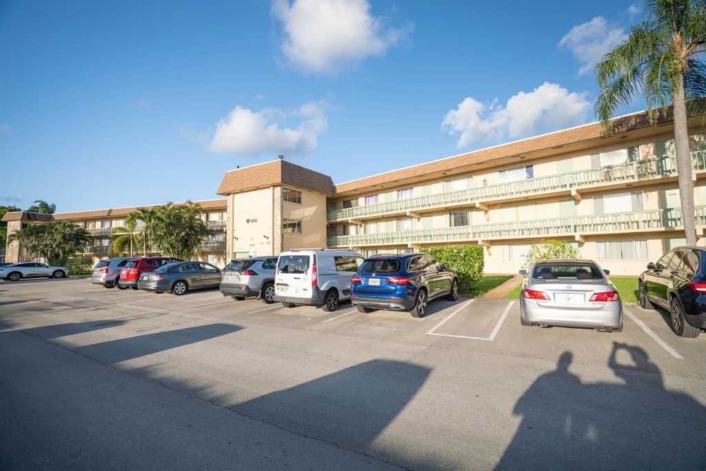 Photo of 400 W Village Green Cir Circle W #214, Palm Springs, FL 33461 (MLS # B26025955)