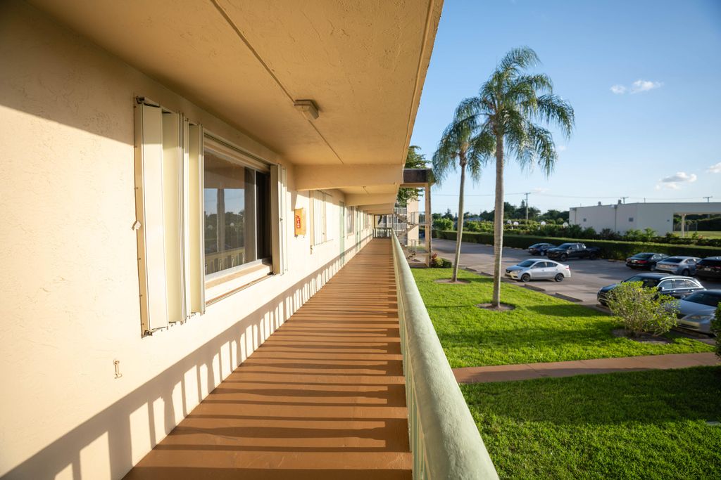 Photo of 400 W Village Green Cir Circle W #214, Palm Springs, FL 33461 (MLS # B26025955)