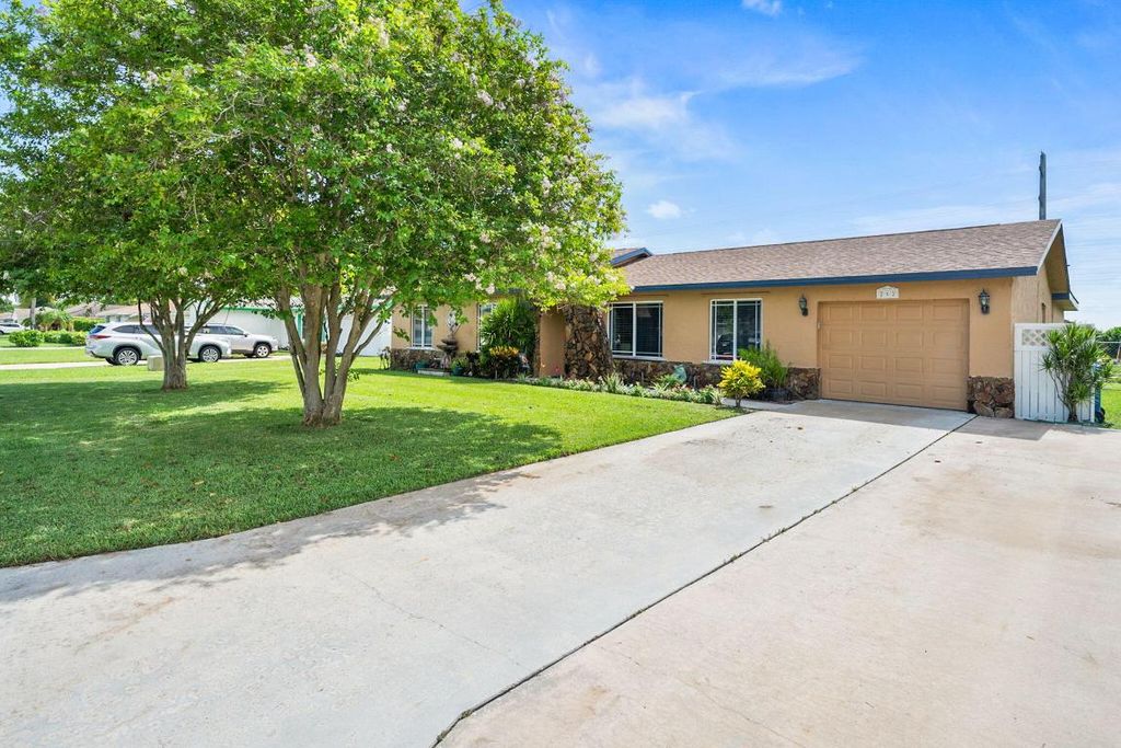 Photo of 262 Sandpiper Avenue, Royal Palm Beach, FL 33411 (MLS # R10997191)