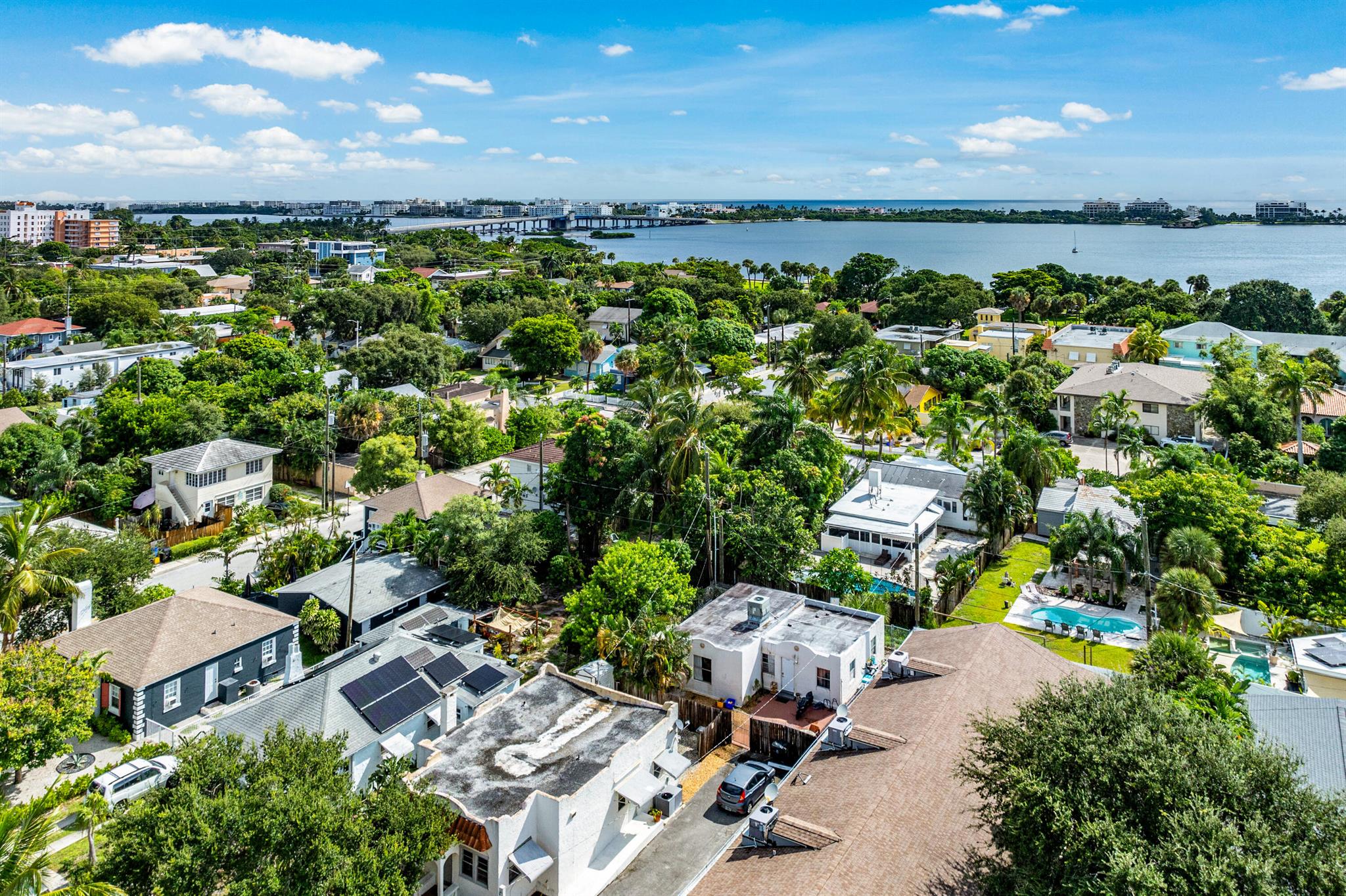 Location location location! This darling Spanish Style Lake Worth Beach property is 3 blocks from the intraoastal and around a mile to the city's own ocean beach! The downtown area is lovely with shopping, dining, parks, entertainment. The main house has 2 bedrooms and 1 bathroom and the guest house has 2 bedrooms 1 bathroom. beautiful original hardwood floors in the main house, and Mexican Tile in the guest house. There is laundry in both. Both units freshly painted. This area has many amenities, and is popular with vacationers and tourists. There is a convenient new Ride Circuit service in the area that goes to the beach and downtown areas for a $1/person/ride.