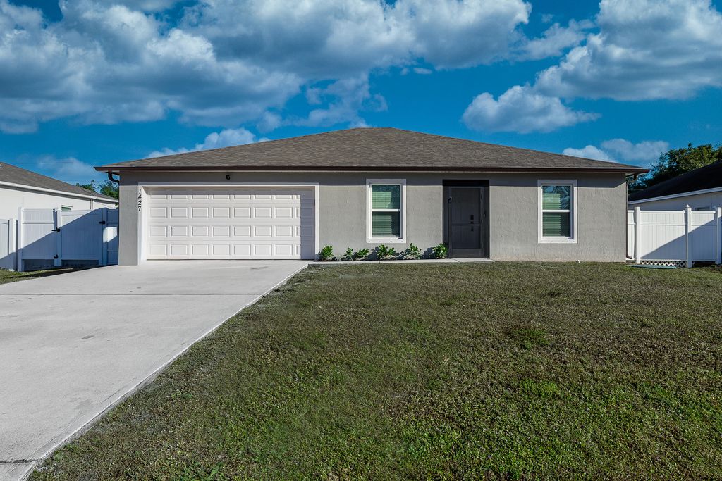 Photo of 1427 SW Leisure Lane, Port Saint Lucie, FL 34953 (MLS # R11152501)