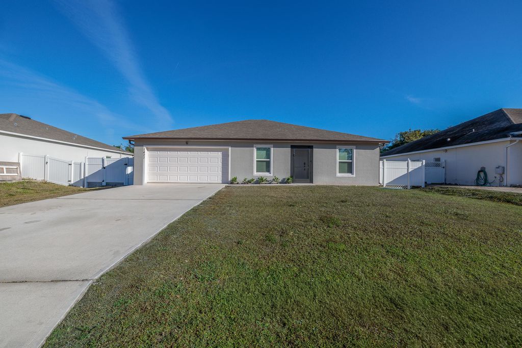 Photo of 1427 SW Leisure Lane, Port Saint Lucie, FL 34953 (MLS # R11152501)