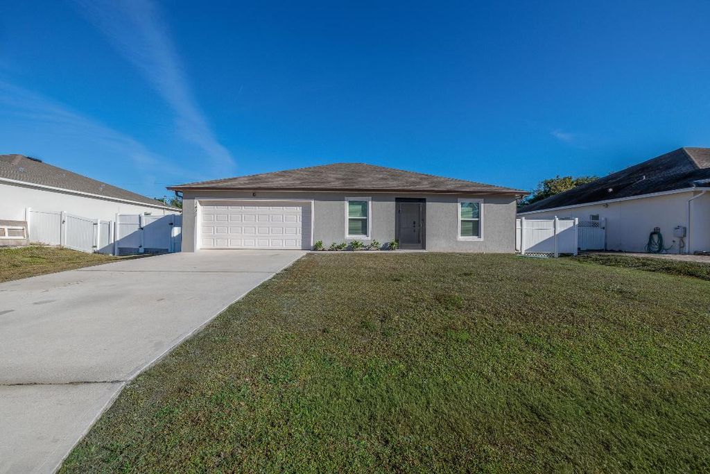 Photo of 1427 SW Leisure Lane, Port Saint Lucie, FL 34953 (MLS # R11152501)