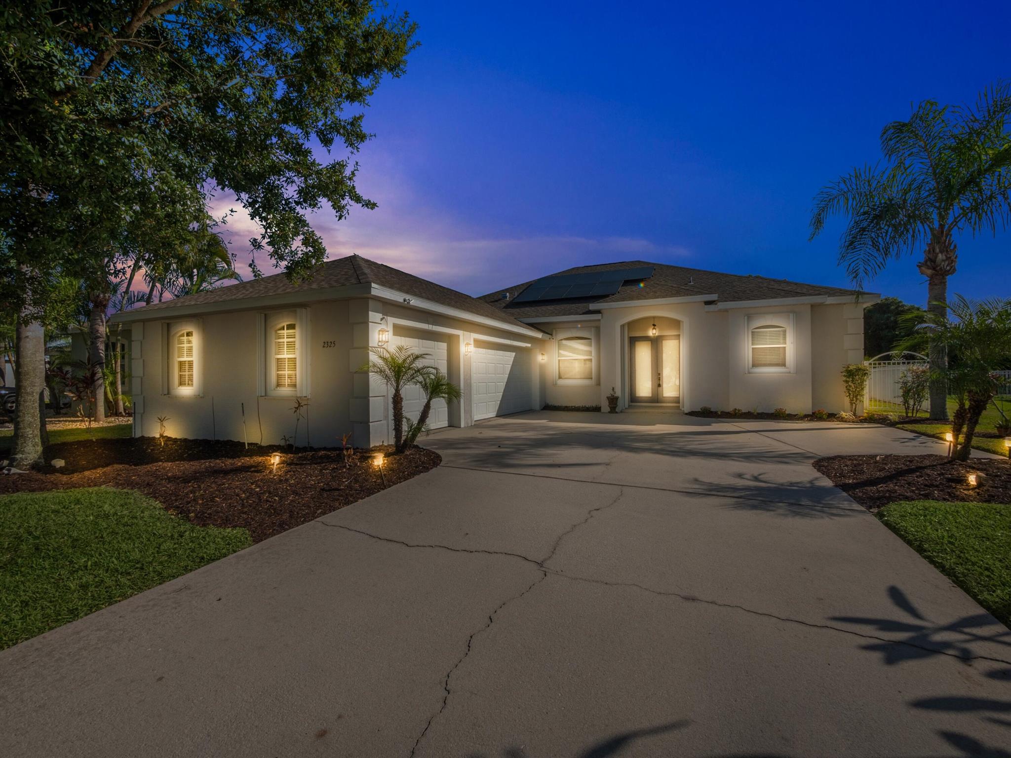 Rarely available Osprey model w/ 4 bedroom and 3 bath and 3 car garage home located in the premier community of The Pines of Pineapple Plantation in Jensen Beach! NEW roof in 2022. Includes NEW solar system in 2021 costing $83,509. Seller will pay the loan at closing. Buyer gets super low electric bills and no payments after closing. NEW AC in 2021. NEW water heater2021. Luxury wood style flooring, open and spacious floor plan and custom lighting fixtures. The kitchen features sleek countertops, white cabinetry, and upgraded appliances. Enjoy the outdoor living space, complete with a large fenced in backyard and covered patio, perfect for entertaining friends and family, or for simply enjoying the South Florida Lifestyle. Just minutes from great dining, shopping, and world-class beaches
