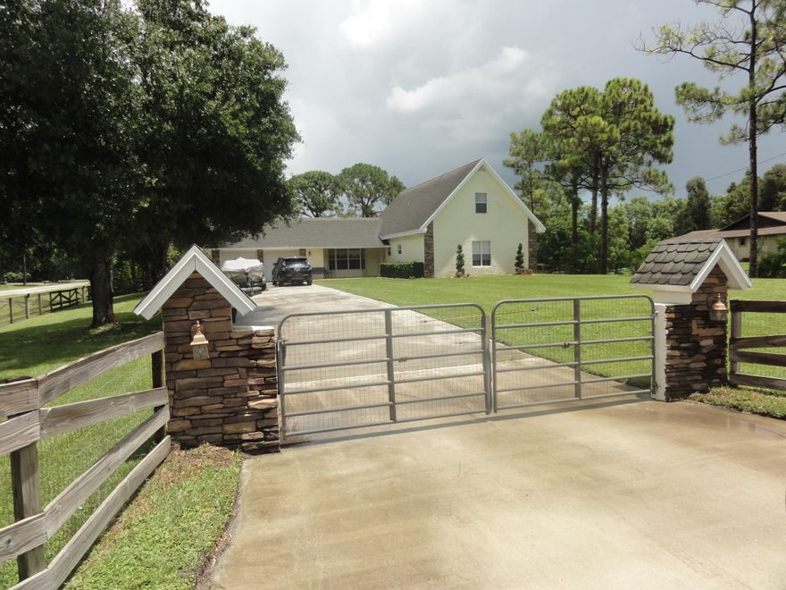 CALL THIS ONE HOME!! A LONG CONCRETE DRIVEWAY LEADS TO THIS UNIQUE POOL HOME WITH LOTS OF UPGRADES.THE LARGE KITCHEN FEATURES WOOD CABINETS, GAS RANGE,TILE BACK SPLASH,DOUBLE OVEN, SNACK BAR AND A WOOD BURNING FIREPLACE. FRENCH DOORS LEAD OUT TO THE BACK PATIO. BRIGHT AND AIRY FLOOR PLAN. THE LIVING ROOM FEATURES WOOD LAMINATE FLOORS. THE HUGE MASTER HAS WOOD LAMINATE FLOORS, WALK IN CLOSET, DOUBLE SINKS,AND TILE SHOWER.THE UPSTAIRS INCLUDES TWO LARGE BEDROOMS, WITH WALL TO WALL CLOSETS AND A FULL BATH.  BACK PATIO IS PERFECT FOR FAMILY GATHERINGS AND PARTIES. LARGE COVERED AREA WITH FLAGSTONE DECK FOR FURNITURE WITH A LARGE OPEN PATIO AS WELL. STEP DOWN TO THE POOL AREA. ADDITIONAL FEATURES INCLUDE WATER TREATMENT SYST., FULLY SODDED FENCED YARD, SHED,GAZEBO,ALL ON A 1.25 ACRE HOMESITE. THERE ARE FRONT AND BACK SPRINKLERS THAT COME OFF OF THE CANAL. NO HOME OWNERS ASSOCIATION. BRING THE HORSES, PETS, AND RV'S. COME AND SEE ALL OF THE SPECTACULAR FEATURES THAT THIS HOME OFFERS.