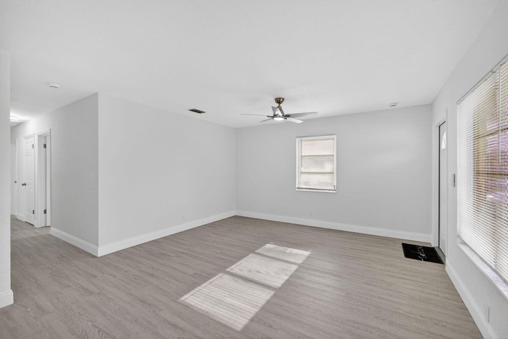 Photo of 1440 Ac Evans Street, Riviera Beach, FL 33404 (MLS # B26018455)