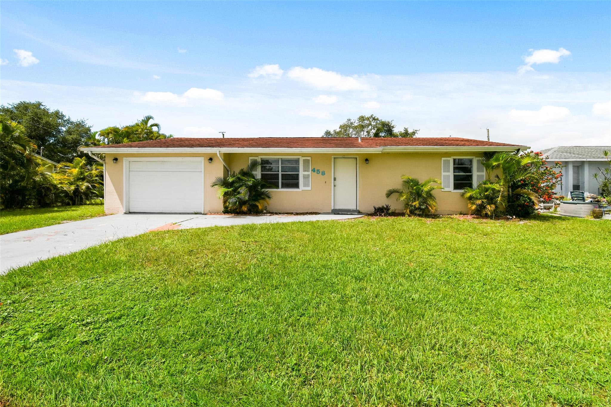 Welcome to 458 SE Galleon Ln, a charming 3-bedroom, 2-bath home in the heart of Port St. Lucie. This bright, open layout offers a spacious living area and an inviting kitchen with ample storage. The primary suite features a private bath and generous closet space, while additional bedrooms are perfect for family, guests, or a home office. Step outside to a private backyard ready for entertaining or relaxing under the Florida sun. With a desirable southeast exposure, convenient access to US-1 and I-95, plus nearby shopping, dining, and beaches, this home blends comfort, location, and value. Don’t miss the chance to make it yours!