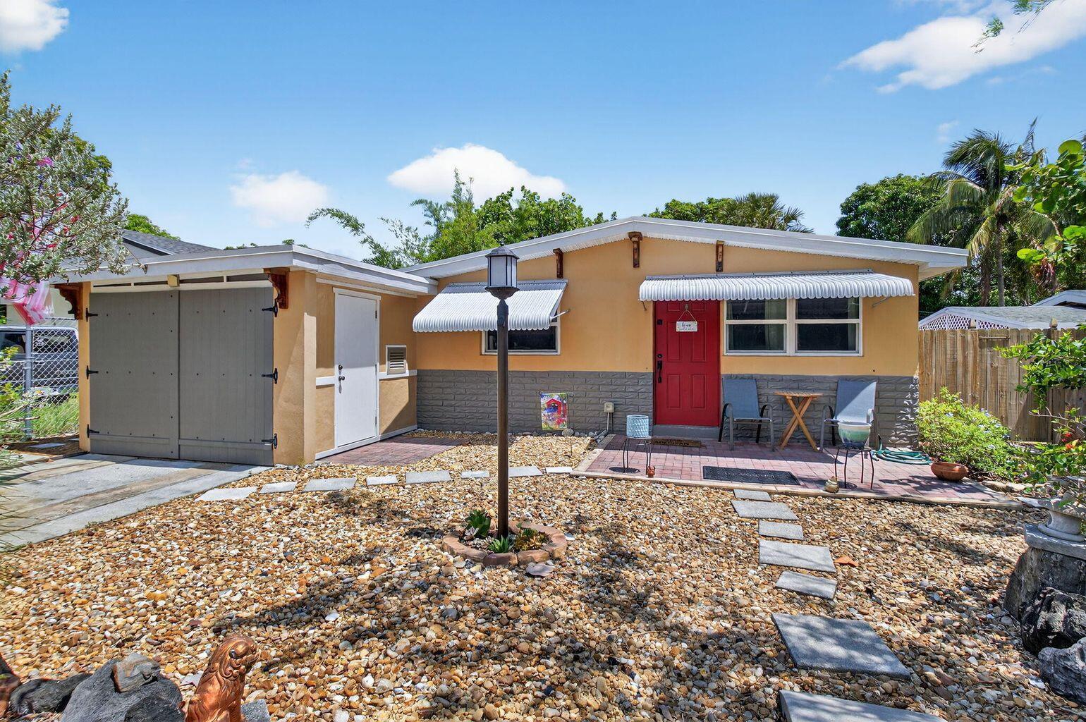 his charming and updated 3bed/2 bath with office home is ideally located just minutes from downtown Boca Raton, Delray Beach, and the beautiful South Florida coastline. Inside, you'll find a thoughtfully designed layout featuring a recent addition, impact windows, updated electrical, and three energy-efficient mini-split A/C systems. The home also showcases original tongue-and-groove ceilings, adding warmth and character throughout. The stunning primary suite is a standout, with soaring ceilings, an oversized walk-in closet, and a spacious, serene atmosphere. Outside, enjoy a private backyard