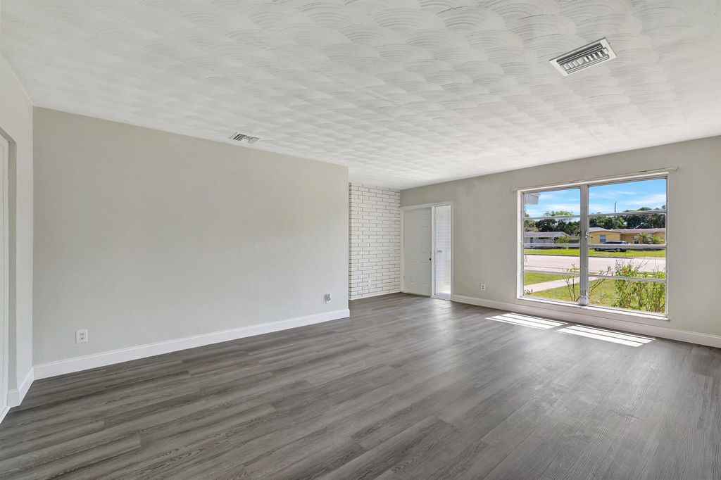 Photo of 209 NE Prima Vista Boulevard, Port Saint Lucie, FL 34983 (MLS # R10969323)