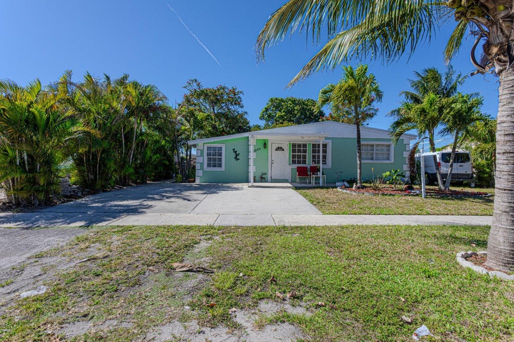 Photo of 3899 Tuskegee Drive, Lake Worth, FL 33462 (MLS # R11077407)