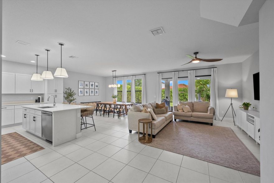 Welcome to this stunning two-story home located in the sought-after community of Sky Cove in Westlake, FL. This residence offers 3 spacious bedrooms, 2.5 bathrooms, a 2-car garage, and full impact windows throughout. From the moment you arrive, you'll be captivated by the breathtaking landscaping, oversized driveway, and massive yard, offering both curb appeal and functionality