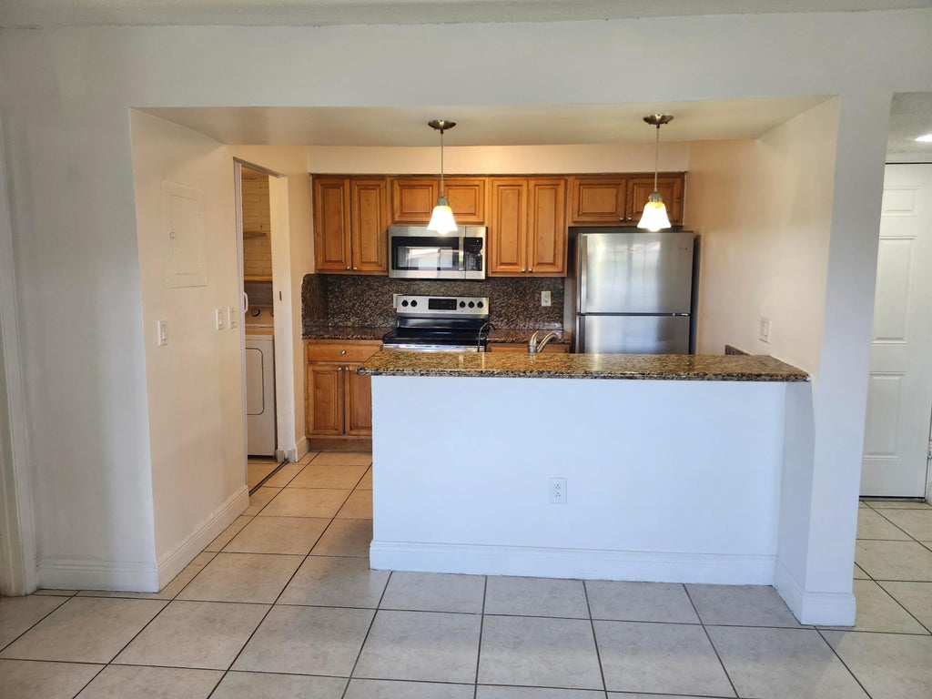 Photo of 1283 SW 46th Avenue, Pompano Beach, FL 33069 (MLS # B26088878)