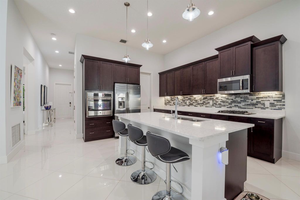 Photo of 5033 Grandiflora Road, Palm Beach Gardens, FL 33418 (MLS # R10926221)