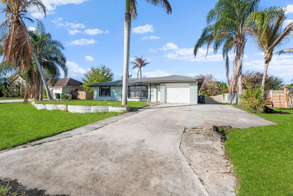 Photo of 1672 SW Schleicher Lane, Port Saint Lucie, FL 34984 (MLS # B26007126)