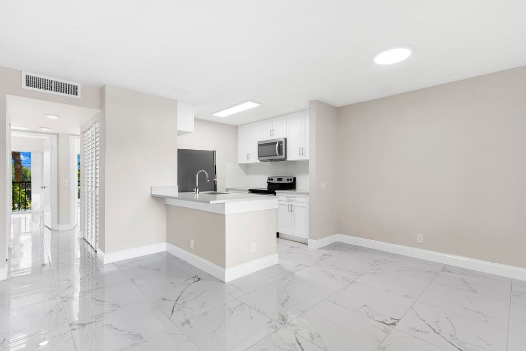 Photo of 712 Meadows Circle, Boynton Beach, FL 33436 (MLS # B26028969)