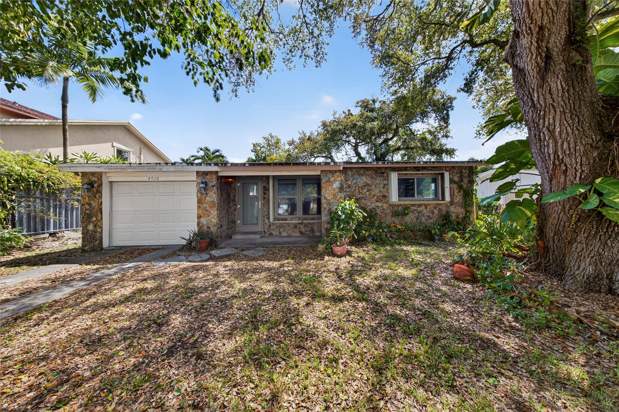 Don’t miss this move-in ready home! Featuring a renovated kitchen and a contemporary primary bath with walk-in shower, this home combines comfort with style. Peace of mind comes built in with a 2018 roof and upgraded impact windows and doors - upgraded electric panel as well makes for an easily insurable home. A one-car garage adds convenience, while mature trees provide shade. Homes this ready and updated don’t last long—schedule your showing today before it’s gone! More photos will be posted shortly.