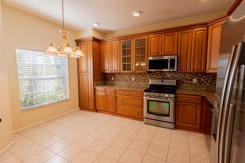 Photo of 322 NW Alana Avenue, Port Saint Lucie, FL 34986 (MLS # R11050816)